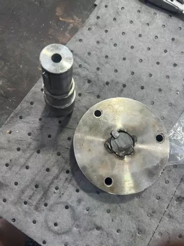 Damaged pump-to-engine drive shaft and coupling removed during industrial diesel hot pressure washer repair in Dover